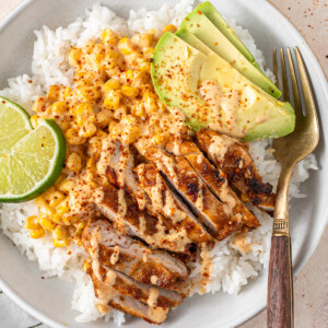 Close up of an assembled dairy free street corn chicken rice bowl.
