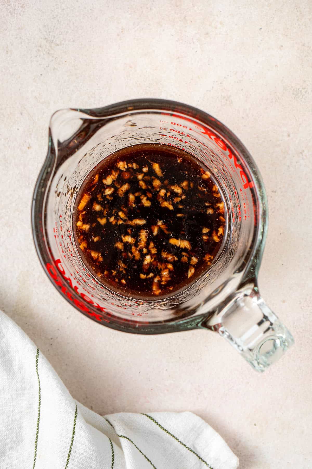 The sweet chilli sauce mixed together in a glass jug.