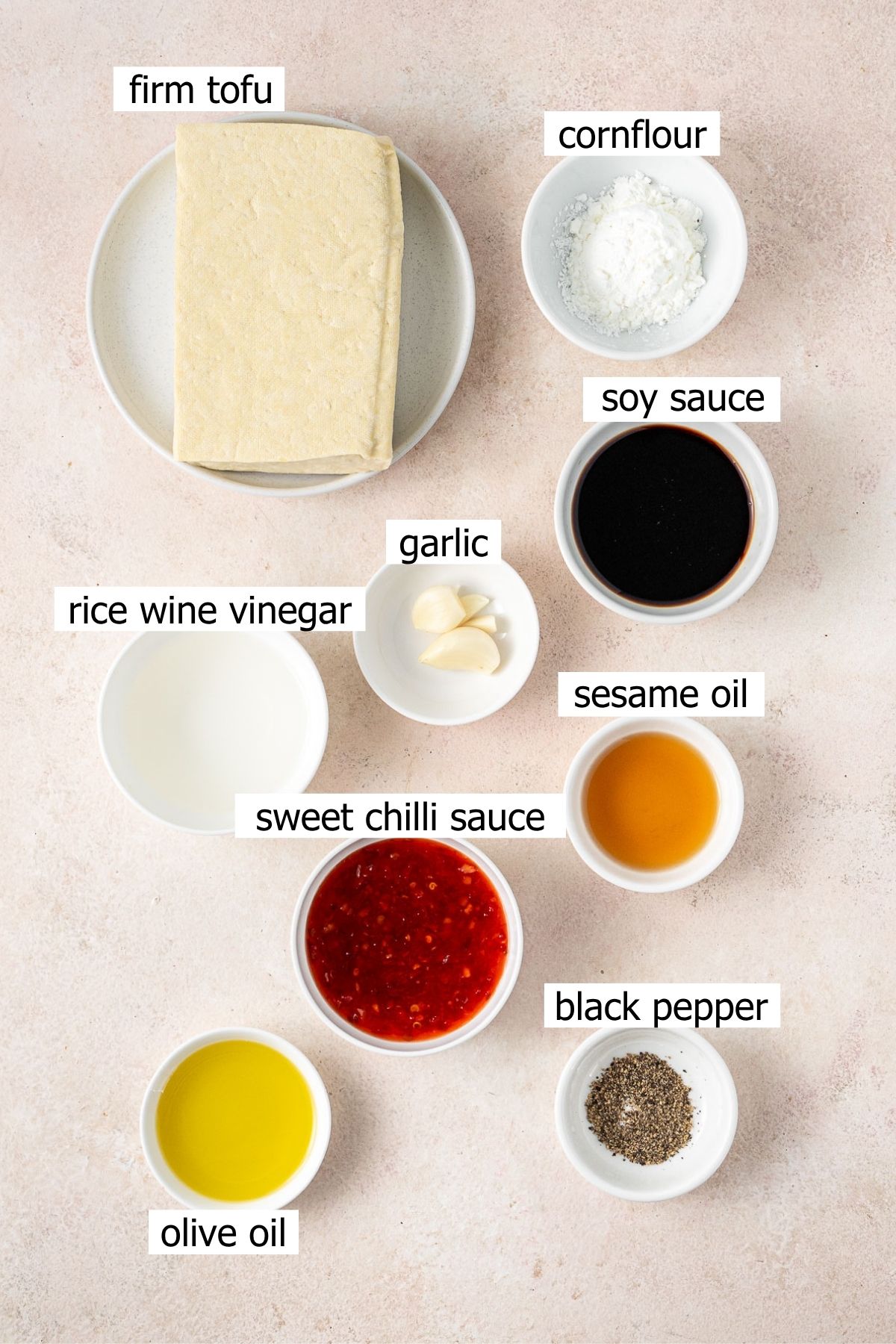 All ingredients needed to make sweet chilli tofu laid out in bowls.